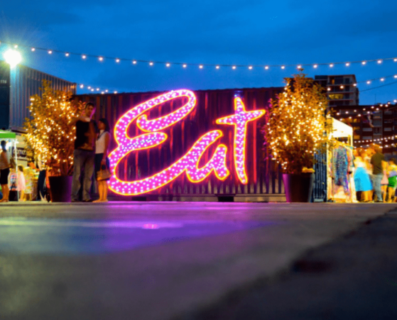 Eat Street Northshore entrance siwth a vibrant neon 'Eat' Sign